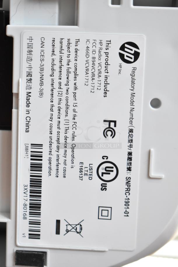 HP DeskJet 2755e printer label with regulatory details, FCC ID, and "Made in China" marking.