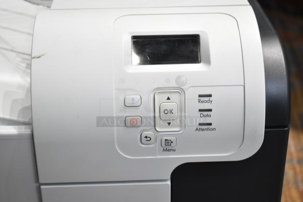 HP Color LaserJet CP3525x printer control panel, showing buttons and status indicators, in good condition.