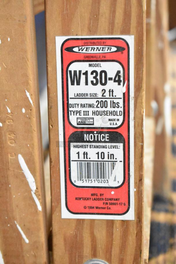 Two wooden 2' ladders, including Werner W130-4 model, 200 lb capacity, Type III household use, good condition.