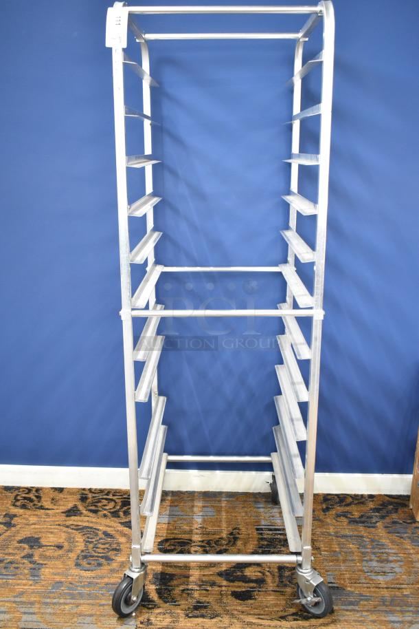 Commercial pan transport rack with multiple shelves, on durable commercial casters. Silver finish, ideal for kitchen use.