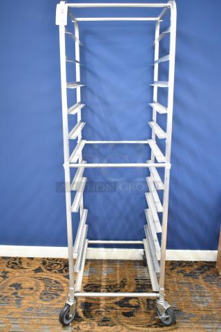 Commercial pan transport rack with multiple shelves, on durable commercial casters. Silver finish, ideal for kitchen use.