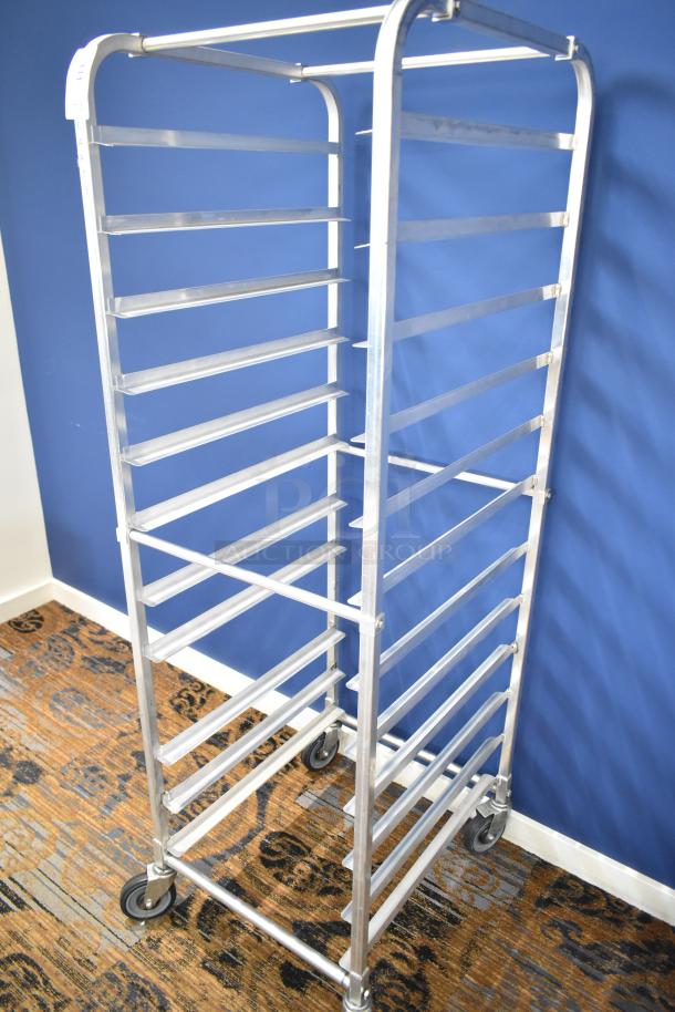 Commercial pan transport rack with multiple shelves on durable commercial casters, in excellent condition.