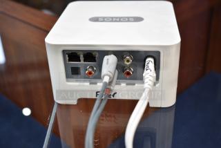 Sonos Box with two Ethernet ports, digital and analog audio ports, in excellent condition, tagged with "SONOS".