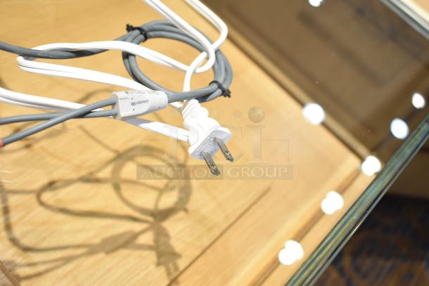 Alt text: Sonos Connect cables featuring a white power plug and gray audio cables. Labels indicate "Binary."