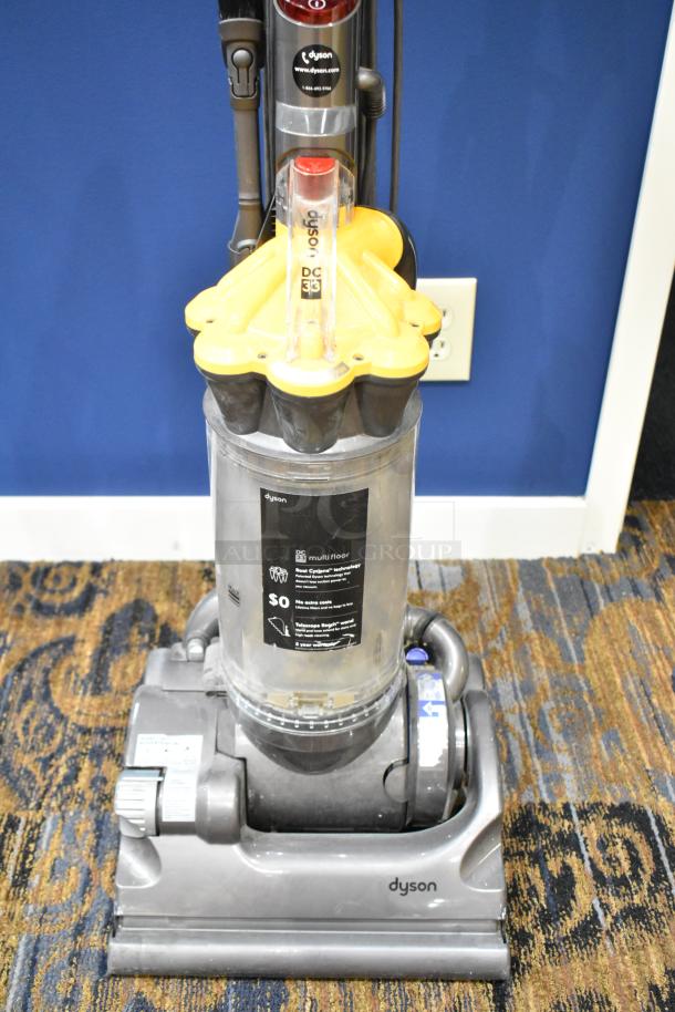 Dyson DC33 Vacuum Cleaner, 115 Volts, upright model, bagless, multi-floor capability, visible cyclone technology, used condition.
