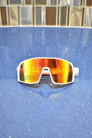 Brand new white framed sunglasses with BluBlocker orange lens. Sleek design, perfect condition.