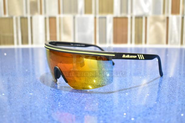 BRAND NEW black framed sunglasses with BluBlocker orange lenses, stylish and functional, ideal for sun protection.