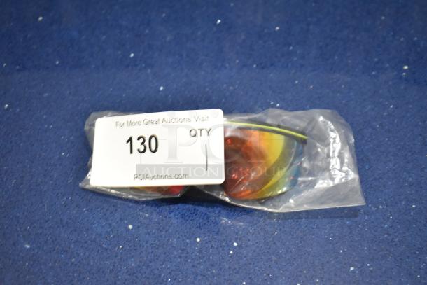 Brand new black-framed sunglasses with BluBlocker orange lens, in packaging. Auction tag number 130 visible.