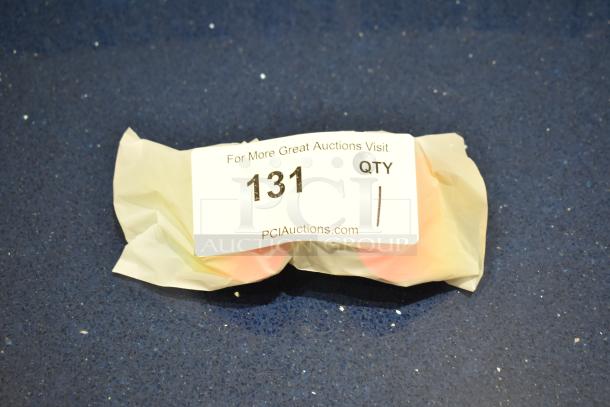 Brand new yellow framed sunglasses with BluBlocker orange lens, wrapped in tissue with auction tag number 131.