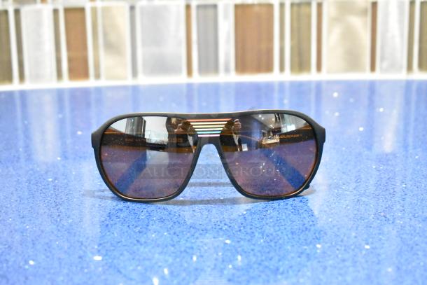 Black framed sunglasses with BluBlocker brown lenses, brand new condition.