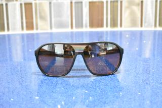 Black framed sunglasses with BluBlocker brown lenses, brand new condition.