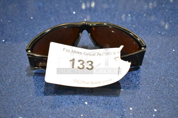 BRAND NEW Viper sunglasses with black frame and BluBlocker brown lenses, auction tag number 133 visible.