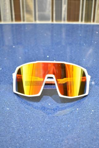 Brand new white-framed sunglasses with BluBlocker orange lenses, reflective surface, and geometric design.