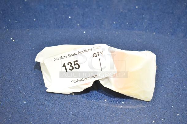 Brand new white framed sunglasses with BluBlocker orange lenses, wrapped in original packaging, labeled "135" for auction.