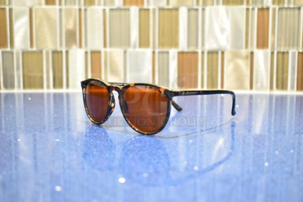 Brand new tortoise shell sunglasses with BluBlocker brown lenses, pristine condition, UV protection.