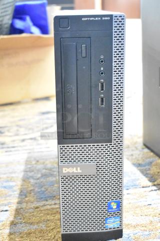 Dell Optiplex 390 computer tower, missing hard drive, front USB and audio ports, DVD drive, Windows 7 and Intel Core i3 labels.