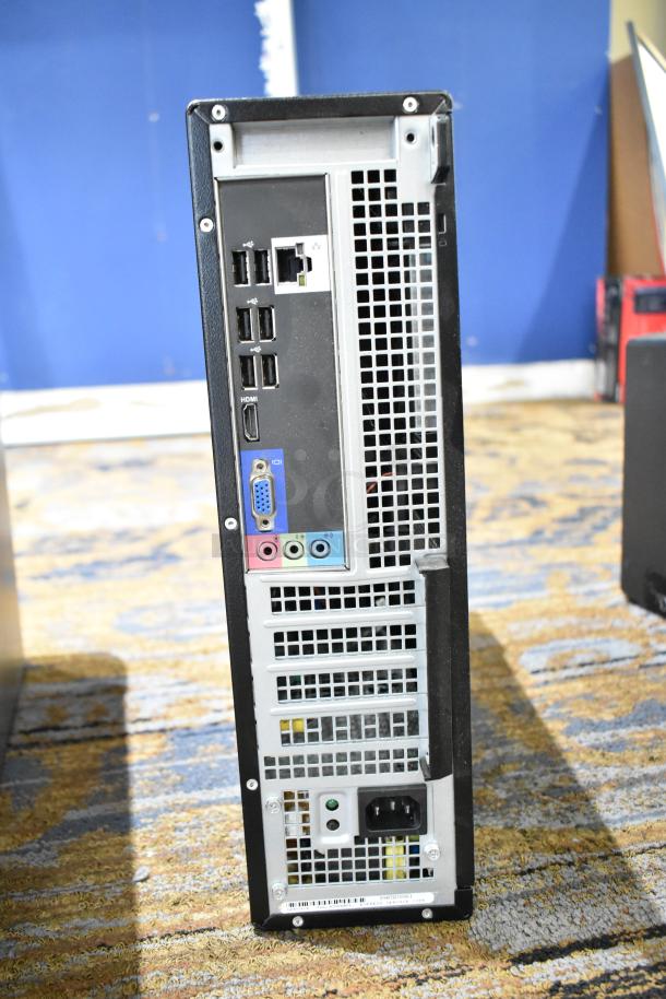 Dell Optiplex 390 computer tower, no hard drive, various ports visible, used condition, shown from rear panel.