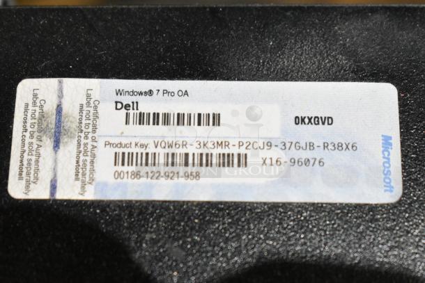 Dell Optiplex 390 tower, lacks hard drive, features Windows 7 Pro OA sticker and product key visible.