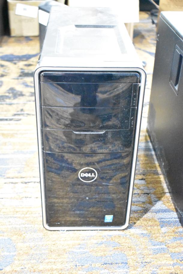 Dell computer tower, black front panel, Intel sticker, no hard drive, used condition, visible Dell logo.