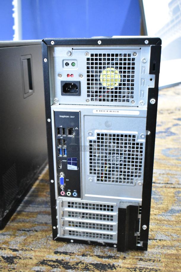 Dell Inspiron 3847 computer tower, no hard drive, visible rear ports and air vents, in used condition.