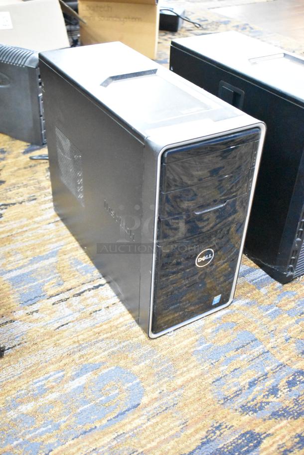 Dell computer tower, black, no hard drive, intact exterior, features Dell logo on front panel.