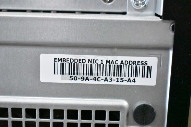 Dell PowerEdge T130 tower without hard drive. Label shows "Embedded NIC 1 MAC Address" with MAC: 50-9A-4C-A3-15-A4.