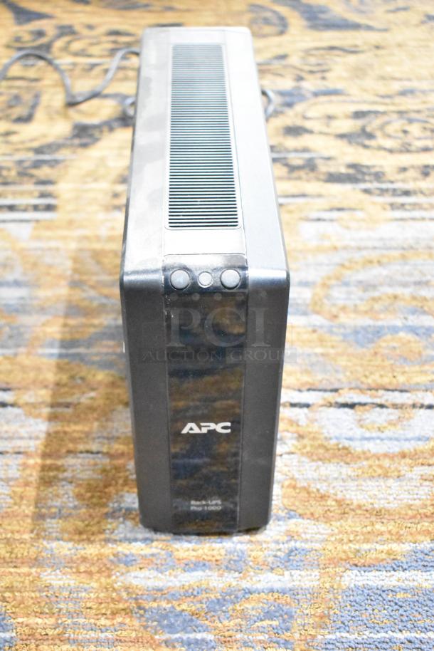 APC Pro 1000 Back UPS, black, no hard drive, visible surface wear, labeled with logo and model name.