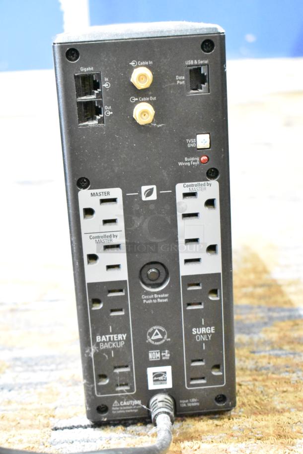 APC Pro 1000 Back UPS, multiple outlets, USB, serial, Gigabit ports, no hard drive, in good condition, with reset button.