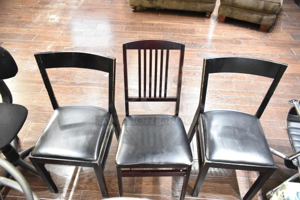 13 assorted chairs including gray Tolix-style dining chairs, floral armchair, office chair, and wooden armchair. Various conditions.