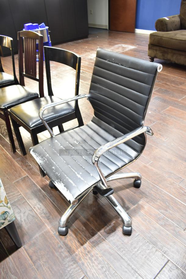 13 assorted chairs, including gray Tolix-style dining chairs, floral armchair, office chair with visible wear, and wooden armchair.