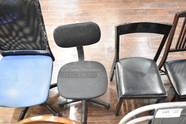 13 assorted chairs including gray Tolix style, floral armchair, office, and wooden armchairs, in used condition.