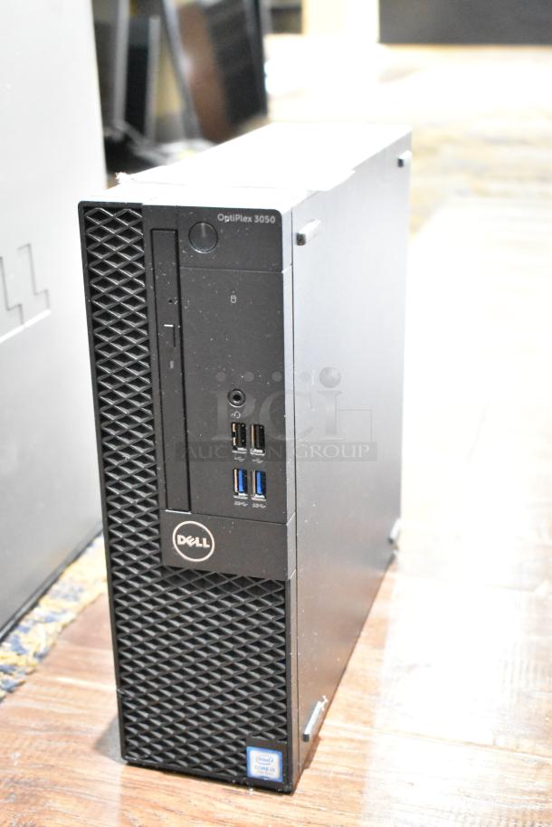 Dell Optiplex 3050 computer tower, no hard drive, front USB ports, audio jack, Intel Core i5 sticker, good condition.