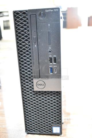 Dell Optiplex 7070 computer tower, no hard drive, multiple USB ports, audio jack, and sleek front panel with Dell logo.