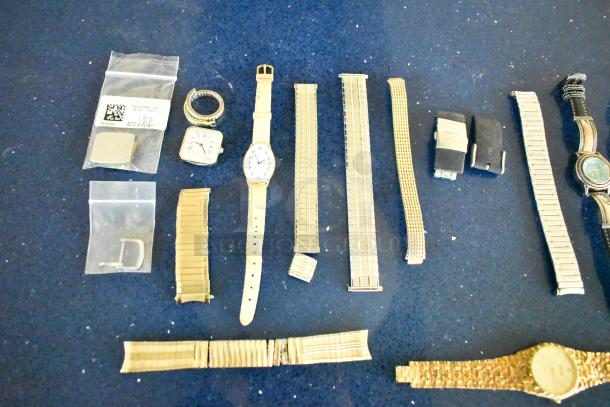 Assorted 27-piece auction lot featuring 5 watches, multiple watch bands, and various accessories in mixed conditions.