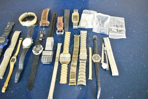 Assorted watches and watch bands, 23 pieces, mixed styles and conditions; includes digital and analog types.