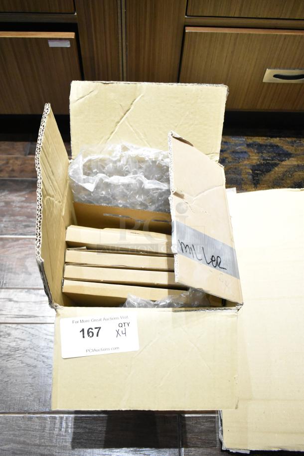 Cardboard box containing four iGuzzini RE18.0 LED lights, wrapped in bubble wrap, with auction tag marked "167 QTY x4".