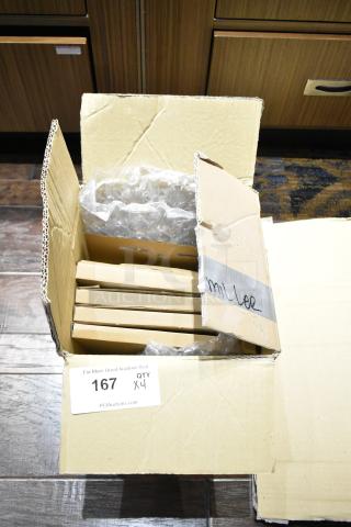 Cardboard box containing four iGuzzini RE18.0 LED lights, wrapped in bubble wrap, with auction tag marked "167 QTY x4".