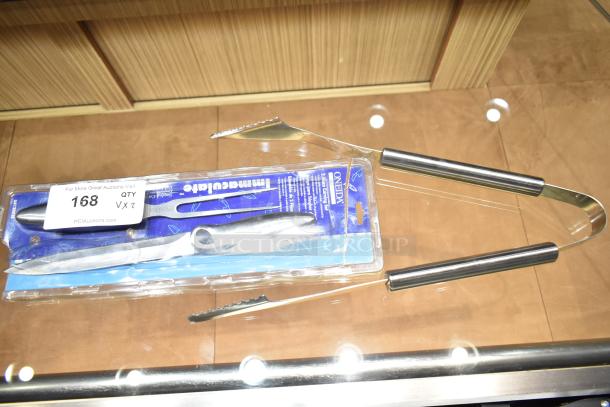 New kitchen set including stainless steel tongs and a packaged Oneida steak fork and knife, auction tag 168.