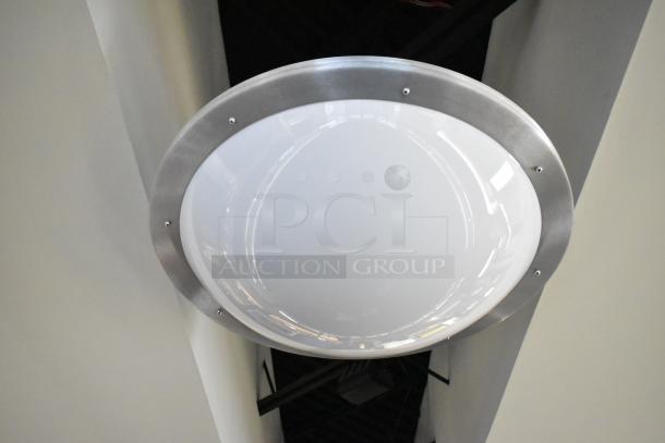 Ceiling mount light fixture with metal trim and frosted glass. Sold in a lot of five; buyer responsible for removal.