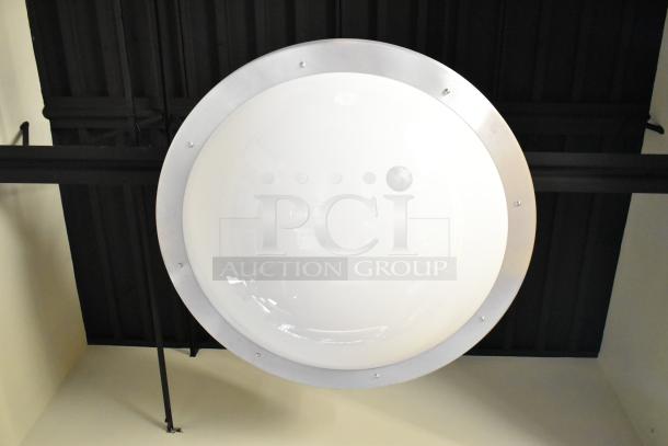 Ceiling mount light fixture with a frosted circular cover and metal rim. Sold as part of a lot of 5. Removal required.