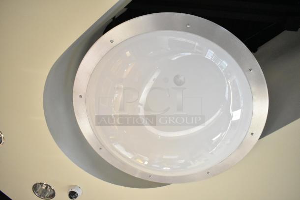 Ceiling mount light with metal trim, round opaque cover; part of a set of 5. Tools required for removal.
