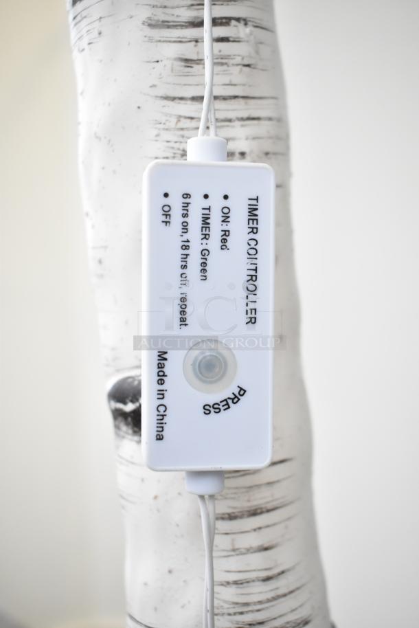 Light-up fake tree with timer controller. Features on/off settings and 6-hour timer. Made in China.