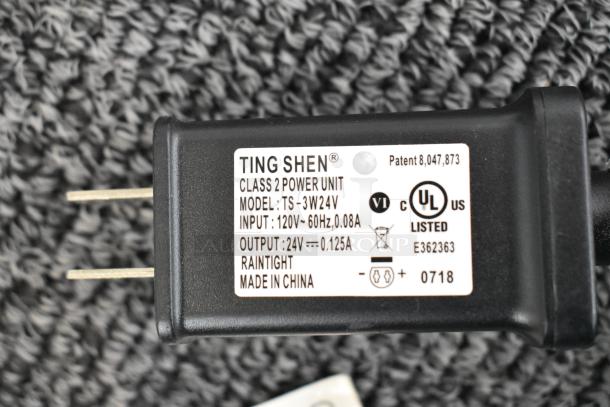 "Power adapter label for light-up fake trees, model TS-3W24V by Ting Shen, input 120V, output 24V, UL listed."