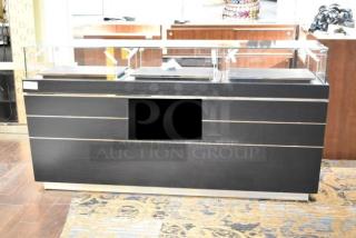 Jewelry case with six rear drawers, black finish, missing branding, requires tools and manpower for removal.