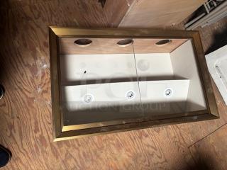 Horizontal wall display case with gold frame, clear glass front, and built-in lights. Condition: Good. Pick-up in Lancaster, PA.