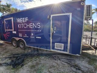 Food trailer with grease hood system, featuring Royal Range, Avantco griddle, gas fryer, and four-unit refrigeration package.