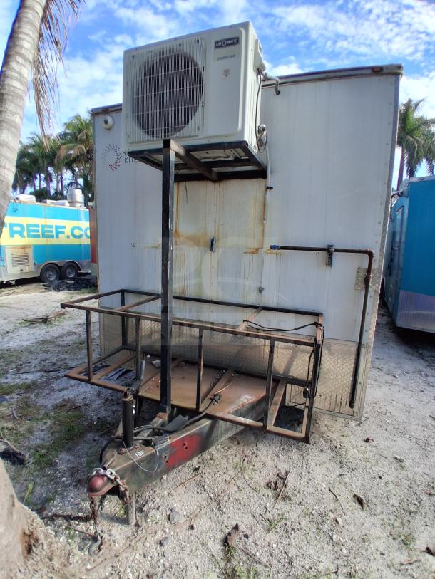 Food trailer with grease hood, Royal Range, Avantco griddle, gas fryer, and four-unit refrigeration. Moderate wear.