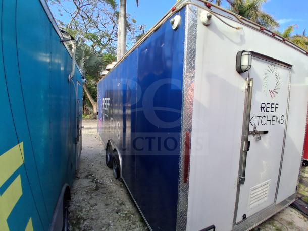 Food trailer with cooking equipment including grease hood, Royal Range, Avantco griddle, gas fryer, and refrigeration.