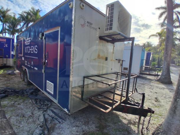 Food trailer with grease hood system, Royal Range, Avantco griddle, fryer, and refrigeration. Blue exterior, mild rust.