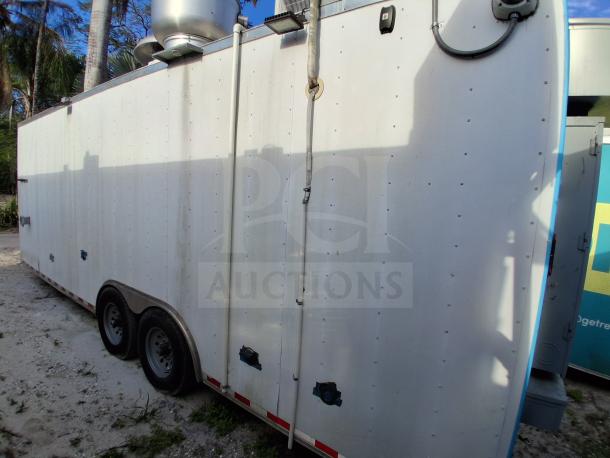 Commercial kitchen trailer featuring grease hood, Dean fryers, Sierra griddle, Wells cooktop, Arctic Air refrigeration.